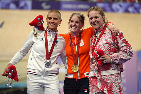 Paris Paralympics 2024 Day 1, Women's C4-5 500m Time Trial final: Netherlands' Caroline Groot, center, gold medal, Canada's Kate O'Brien, right, bronze medalist, and France's Marie Patouillet